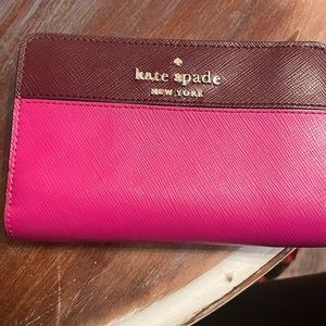 Small Original Kate Spade bifold wallet with coin holder in the middle. New